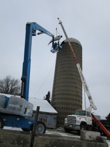 Crane and Two Man Lift Installing Grain Silo Cover